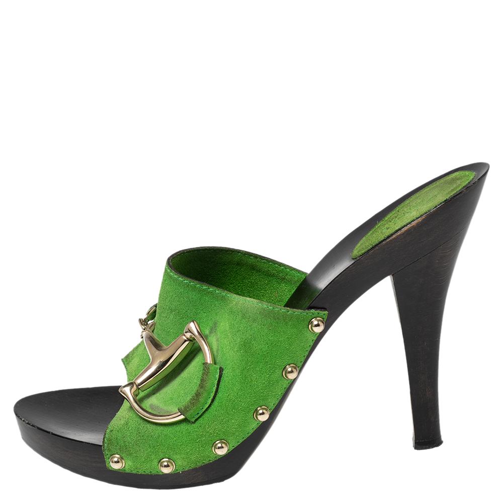 These sandals by Gucci are perfect to be paired with any outfit of your choice. The suede sandals are meant to keep your feet comfortable all day. Designed as clogs, the green sandals are lifted on platforms and 10.5 cm heels.