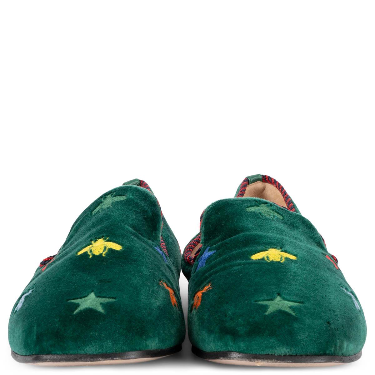 100% authentic Gucci Kibi loafers in green velvet. The design features green, yellow, red, and blue embroidered bees and stars and are trimmed with rd and black striped grosgrain piped edges. Have been worn and are in excellent condition. Comes with