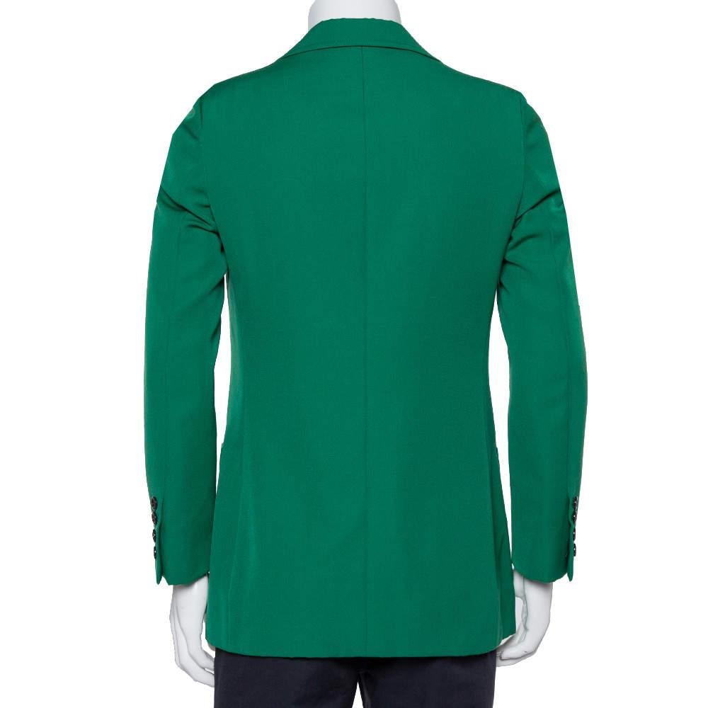 A splendid style statement is assured when you step out wearing this amazing Gucci blazer. The green creation is made of wool and exhibits peak lapels, a chest pocket, two slip pockets, dual front button fastenings, and long sleeves. It will look