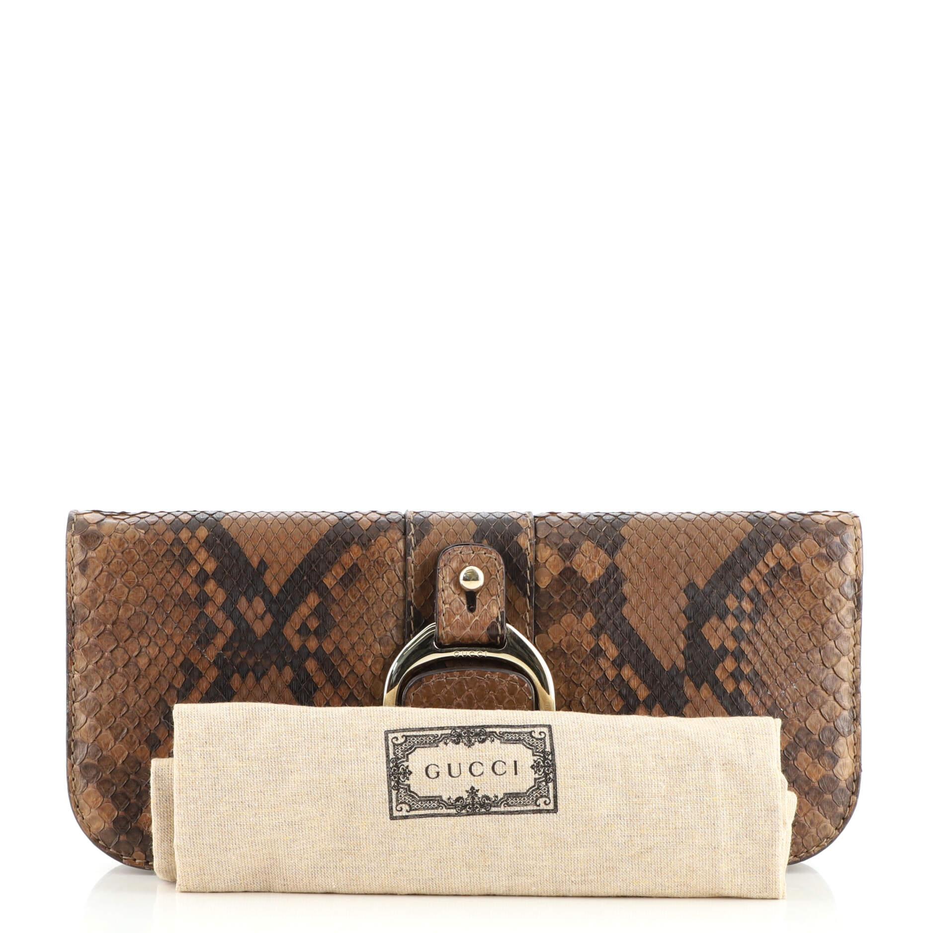 Condition: Good. Odor in interior. Lifting of scales on flap, wear on exterior and in interior, creasing on exterior and underneath flap. Bubbling underneath flap, heavy marks in interior, scratches on hardware.
Accessories: Dust Bag
Measurements: