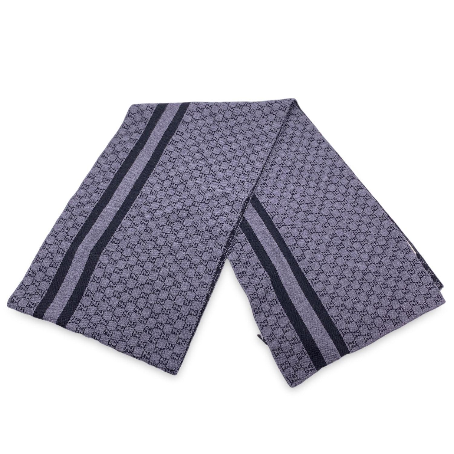 Grey and Black GG jacquard wool scarf by Gucci. Width: 30 cm. Lenght: 200 cm. Made in Italy. Composition:100% wool Details MATERIAL: Wool COLOR: Grey MODEL: n.a. GENDER: Unisex Adults COUNTRY OF MANUFACTURE: Italy FEATURES: Multifunctional PATTERN: