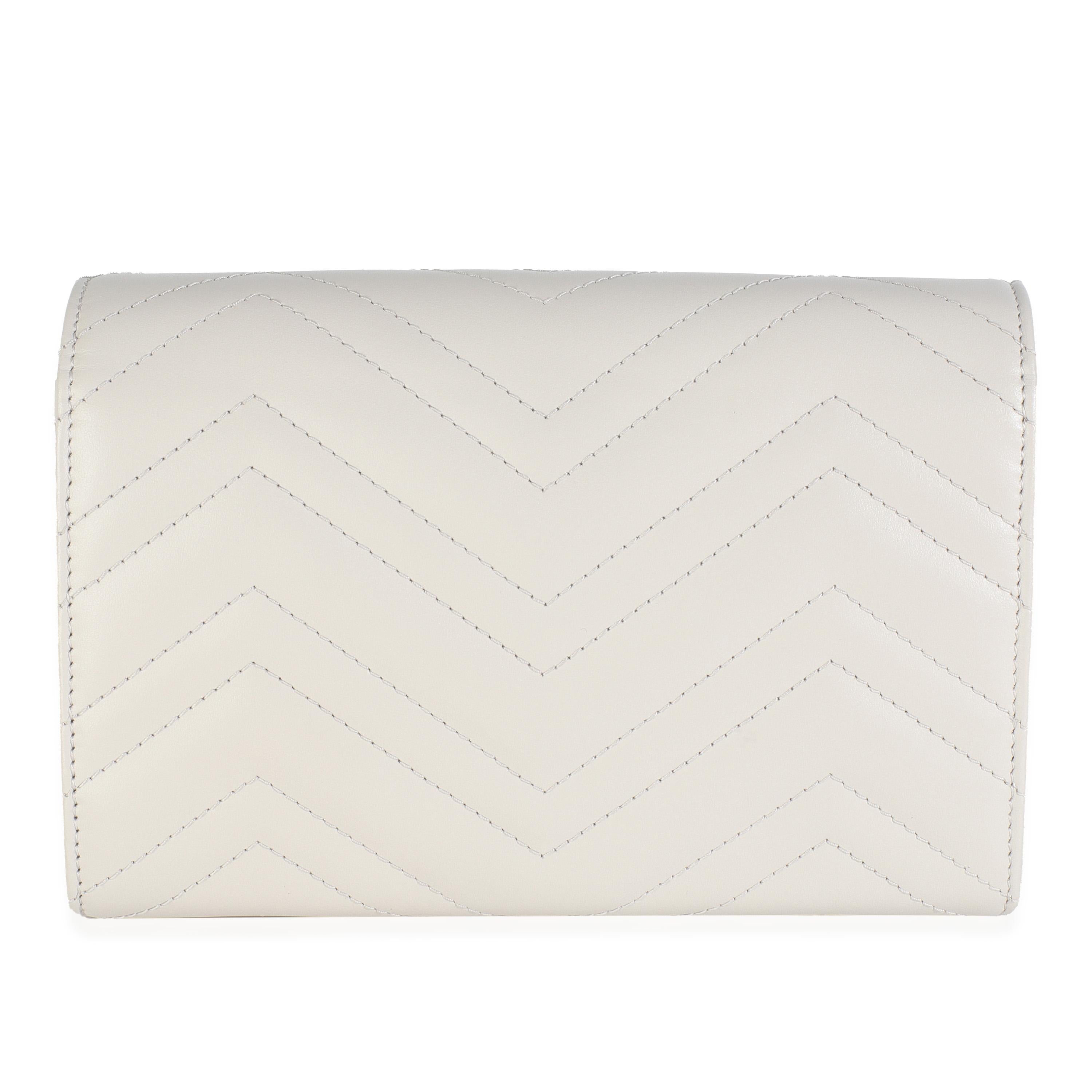 Listing Title: Gucci Grey Calfskin Matelasse GG Marmont Chain Wallet
SKU: 148926
MSRP: 1990.00 USD
Condition: Pre-owned 
Condition Description: The Marmont edit from Gucci is an extension of the House's signature GG belt from the '70s. With a