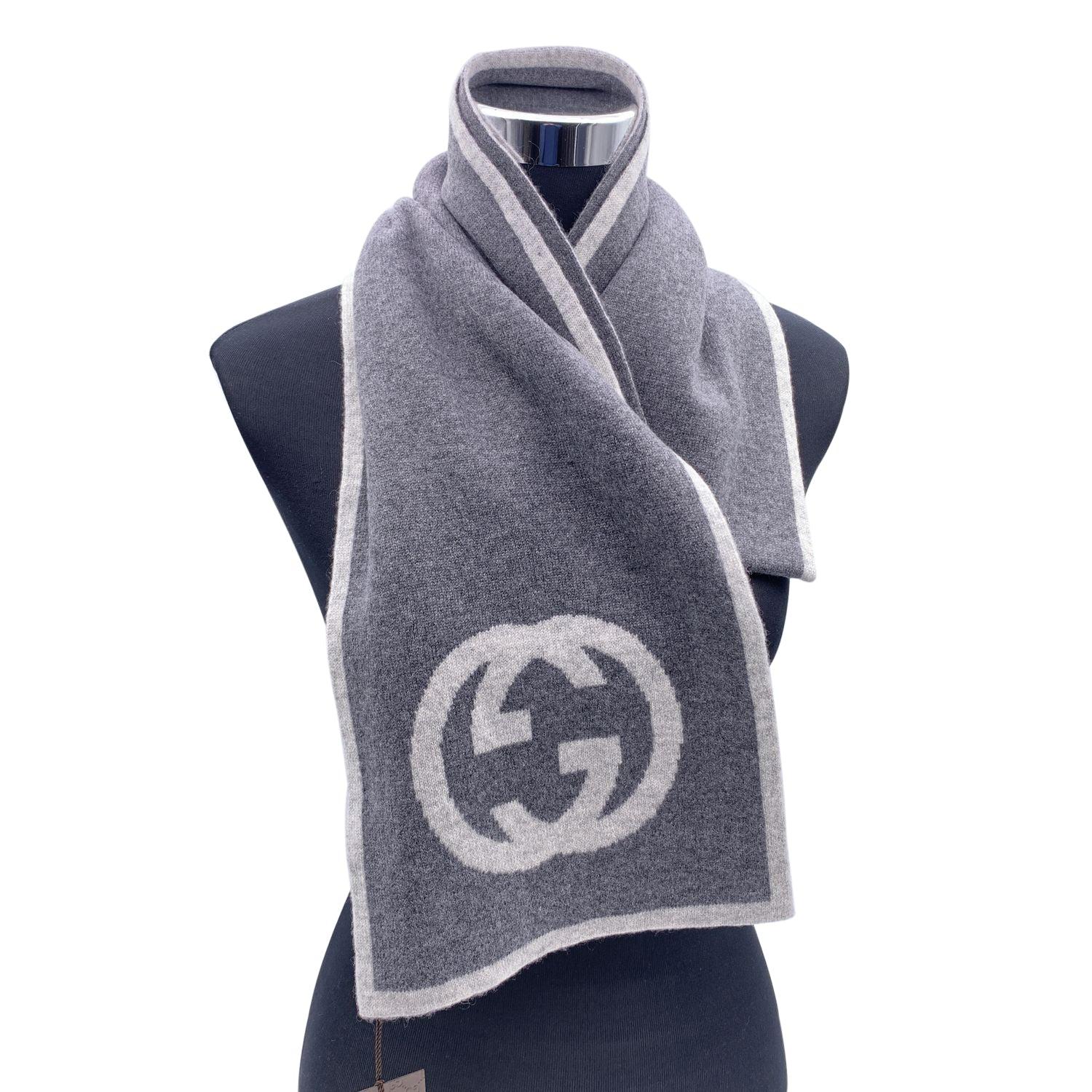 Light Grey and grey GG logo scarf by Gucci. Composition: 100% Cashmere. Width: 23 cm. Lenght: 180 cm. Made in Italy. Details MATERIAL: Cashmere COLOR: Grey MODEL: n.a. GENDER: Unisex Adults COUNTRY OF MANUFACTURE: Italy FEATURES: Multifunctional