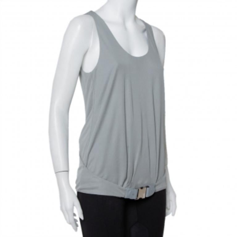 A cool tank top from Gucci for you to look your stylish best on casual outings or while lounging at home. This gorgeous grey top is designed with leather-accented belt detail towards the hem and a cutout back. This knit top adds an air of