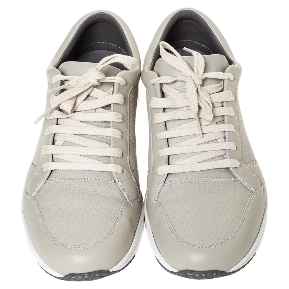 These sneakers are perfectly crafted from supreme quality leather. Designed by Gucci, they are a fine blend of comfort and style. The pair features a simple shade of grey, lace-up vamps and rubber soles for added ease.

Includes: Original Dustbag,