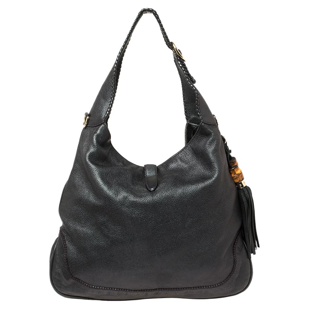 Gucci has always offered a bevy of cult-favorite bags, just like this New Jackie hobo created as a homage to Jacqueline Kennedy Onassis. It is crafted from leather and flaunts a grey shade. A piston push-lock closure opens to a roomy interior that