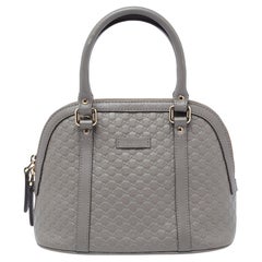 Mini sac à main Gucci en cuir gris microguccissima à dôme