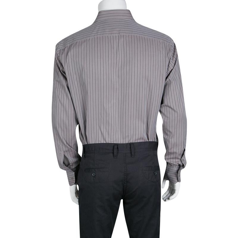 Exhibiting the minimalistic charm of Gucci, this classic grey shirt with perfect fitting must be added to your formal closet. It is fabricated in cotton with a striped pattern all over. It has a button front closure and long sleeves for maximum