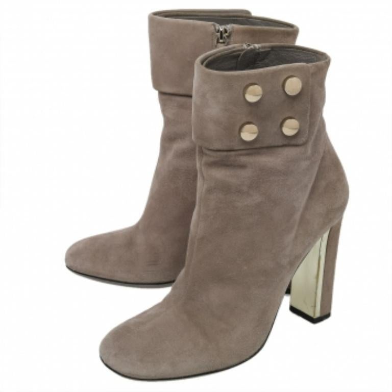 Simple and sophisticated, these booties from Gucci are a must-buy for the fashionable you. These are crafted in suede and come balanced onsturdy heels. They can be paired with a long tunic or an oversized shirt to make quite a style impression.