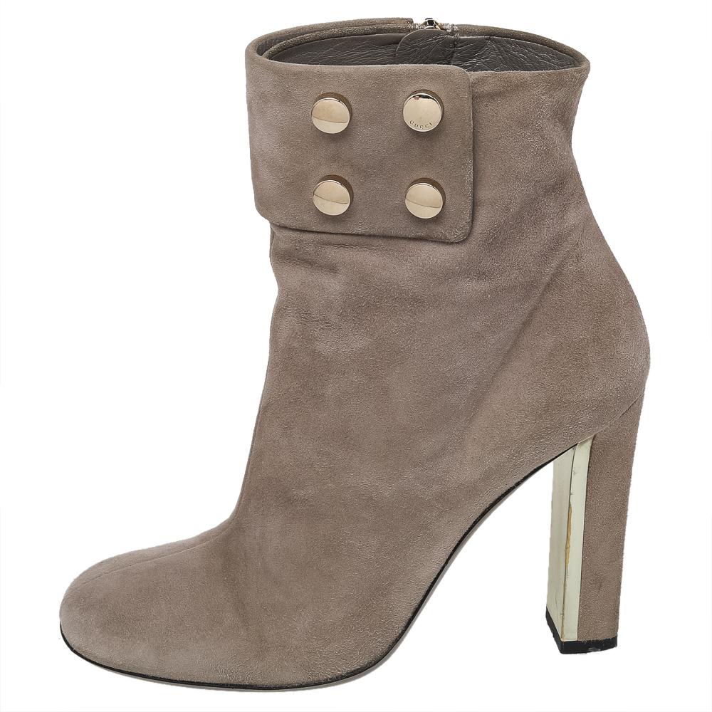 Simple and sophisticated, these booties from Gucci are a must-buy for the fashionable you. These are crafted in suede and come balanced onsturdy heels. They can be paired with a long tunic or an oversized shirt to make quite a style impression.