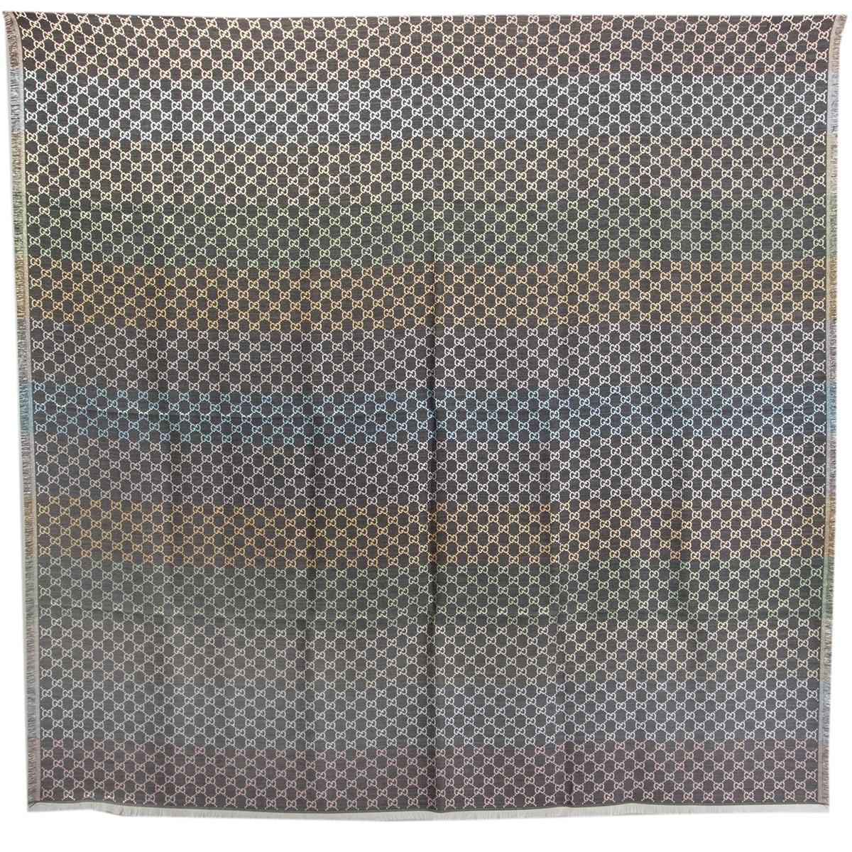 100% authentic Gucci GG Monogram shawl crafted using a jacquard technique and featuring the GG pattern in pastel rainbow grey, light blue, light pink, yellow, light green, champagne and silver 31% viscose 28% cotton 23% wool 10% silk 8% metallic
