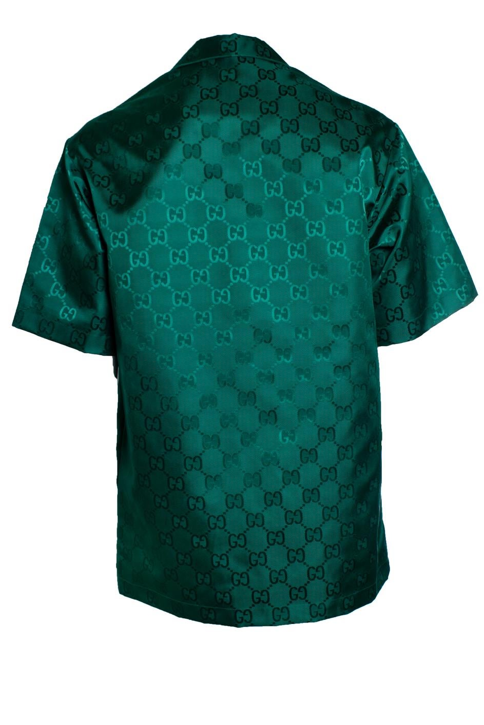 Gucci, Gucci GG Canvas-Bowlinghemd aus Nylon in Grün. Der Artikel ist in sehr gutem Zustand.

CONDIT: sehr guter Zustand

GRÖSSE: IT50 - L

MASSNAHMEN: Länge 82 cm, Breite 58 cm, Taille 59 cm, Schulterbreite 51 cm, Ärmellänge 30 cm

MATERIAL: 100%
