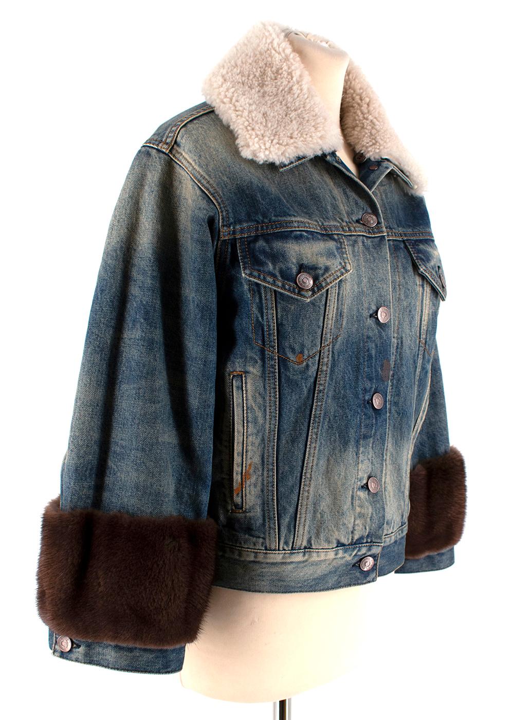 Gucci Guccification Denim Jacket with Mink Fur Trim & Shearling Collar

- Stonewashed Effect
- Mink Fur Sleeve Detail 
- Lamb Fur Turnover Collar
- Red and White Guccification Print 
- Front Button Fastening 
- Button Cuffs
- Two Chest Pockets and