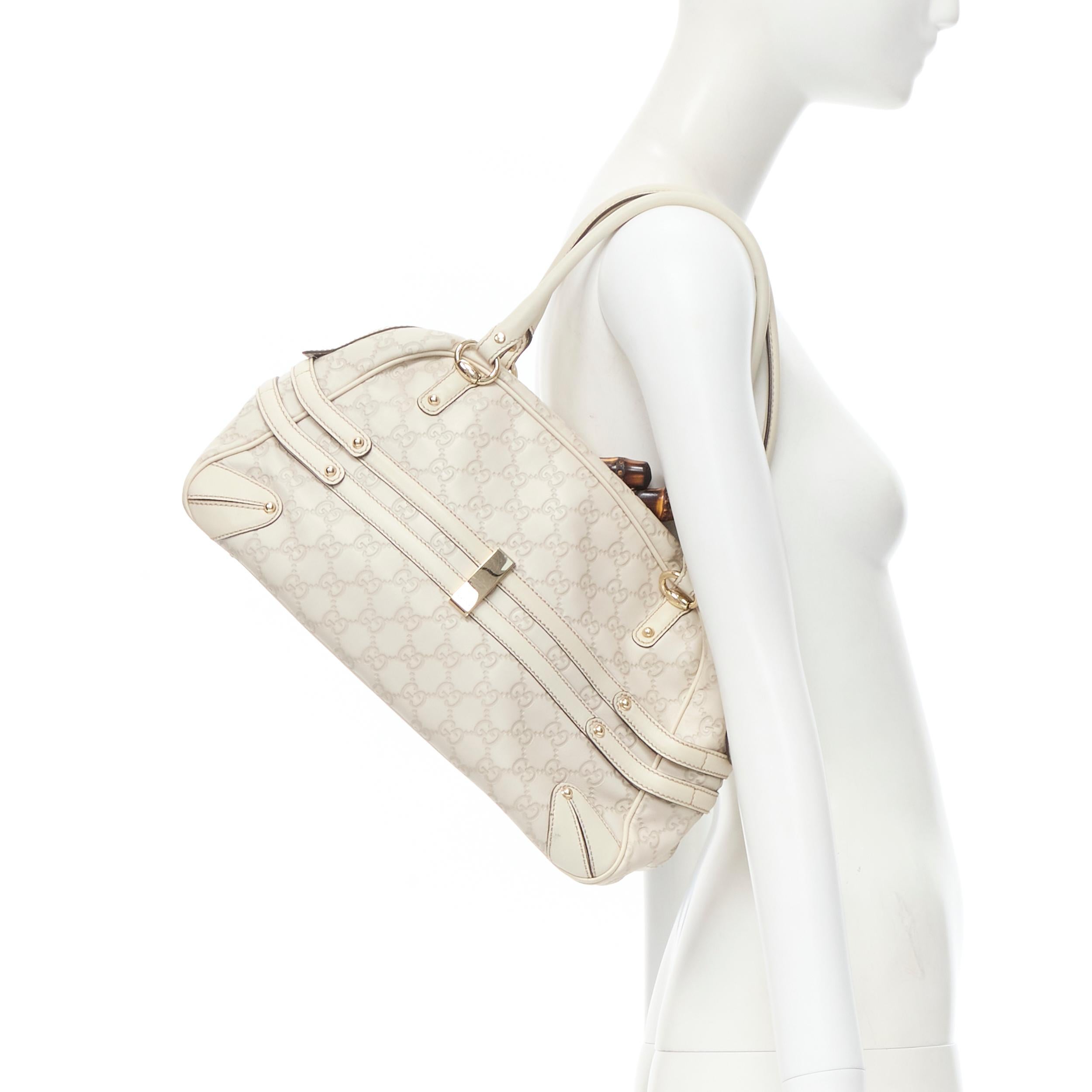 GUCCI Guccisima Wave Boston white monogram emboss Horsebit Bamboo Boston bag 
Reference: CELG/A00034 
Brand: Gucci 
Model: Guccisima Wave Boston 
Material: Leather 
Color: White 
Pattern: Solid 
Closure: Zip 
Extra Detail: 159398. White monogram