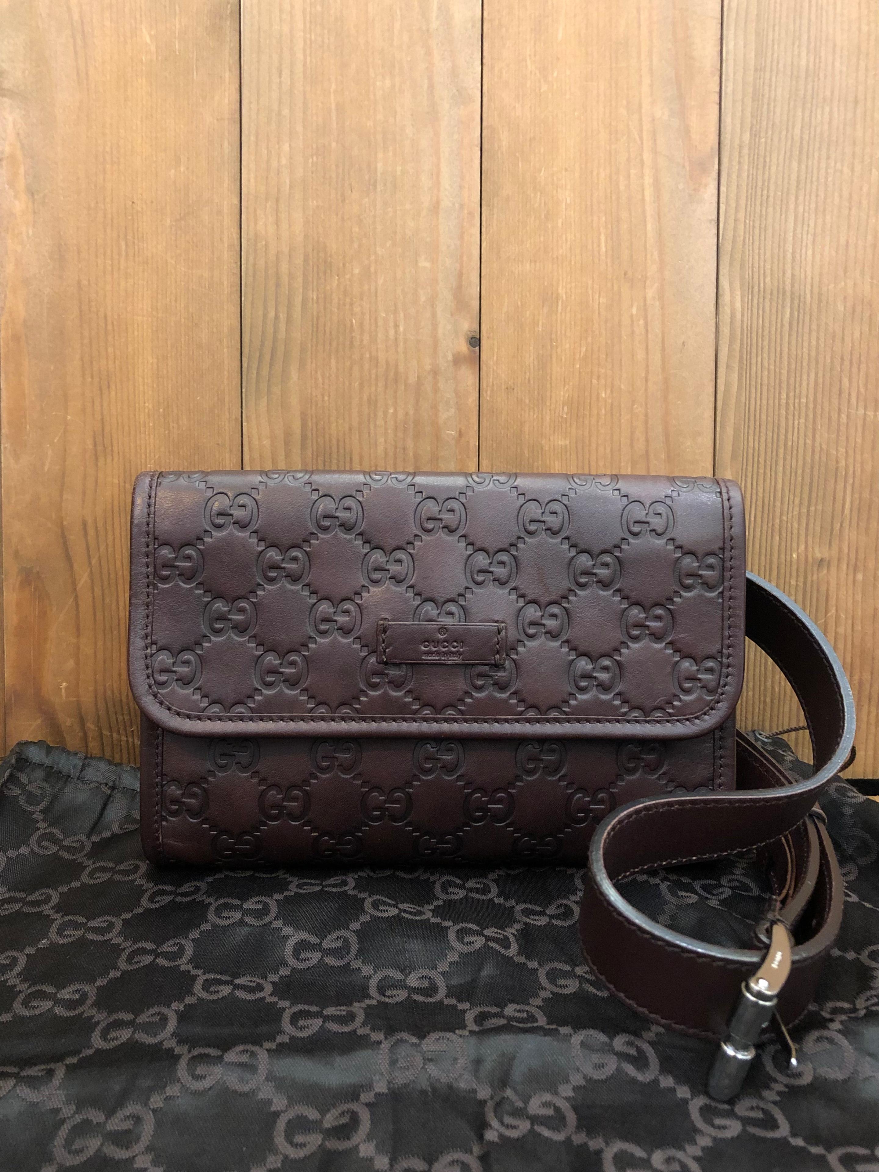 This GUCCI belt bag is crafted of Guccissima GG embossed calfskin leather in chocolate brown featuring silver toned hardware. This Gucci belt bag comes with a detachable calfskin leather belt adjustable with five holes. Front flap magnetic snap