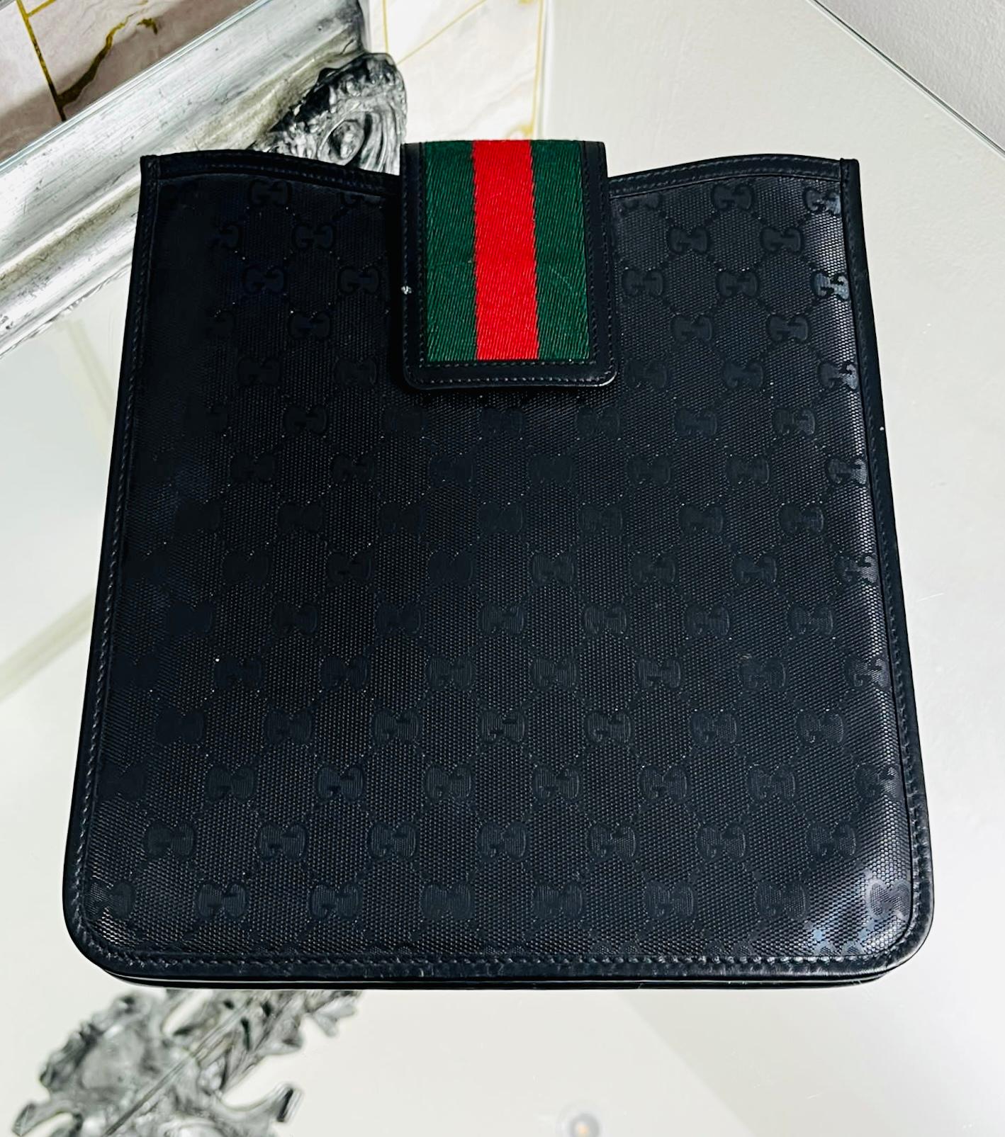 Gucci Guccissima Leather iPad Case

Black case designed with iconic 'GG' logo monogram.

Detailed with the brand's signature green & red Velcro strap closure.

Size – Height 26cm, Width 24cm, Depth 1cm

Condition – Very Good

Composition –
