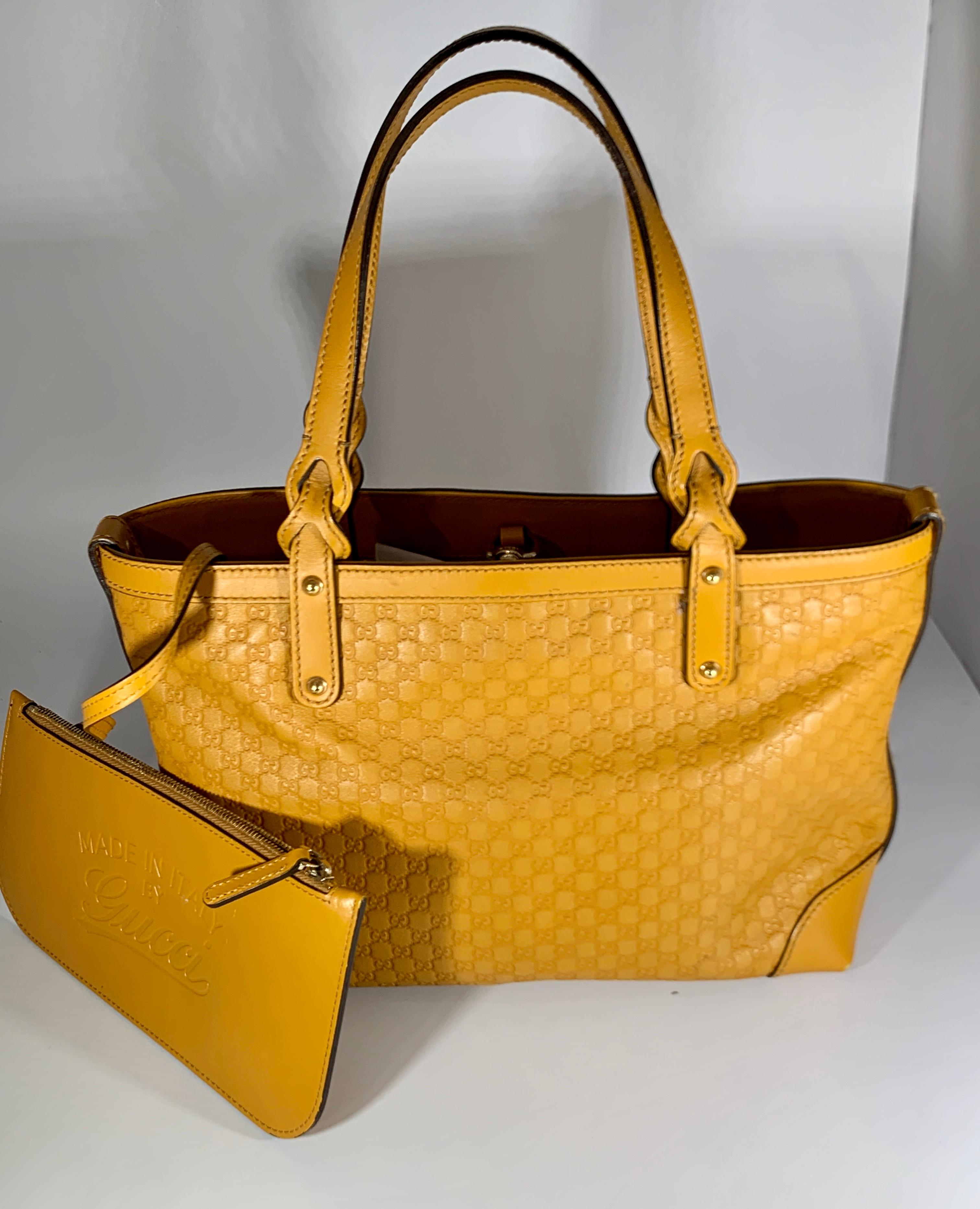 This Is An Authentic, Pre-Owned Piece but looks like brand New. Its in Excellent condition .
The Gucci Leather Small  Bag is big enough for all that we need to carry. The sleek bag features soft and supple Yellow  Guccissima leather and gold tone