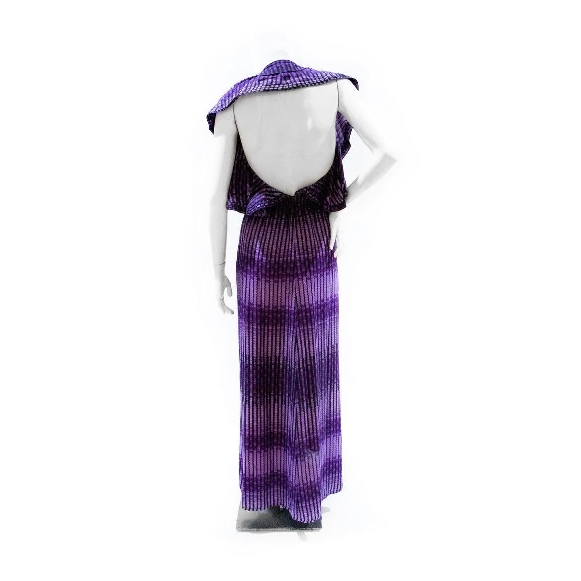 Purple Halter Dress by Gucci 
Fall/Winter 2006
Purple
Circle print 
V Neck line 
Ruffle Sleeve embellishment
Halter
Floor length
Backless 
Condition: Great Condition, Preloved with no visible signs of wear or use, belt is missing (Priced as is, see
