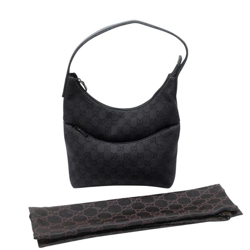 Gucci Hobo Denim and Leather Panel Canvas Shoulder Bag GG-0829N-0004

This chic and sophisticated Gucci Black GG Denim Fabric and Leather Panel Hobo Bag is one you won't want to miss out on. With its sleek design and spacious interior, this bag can