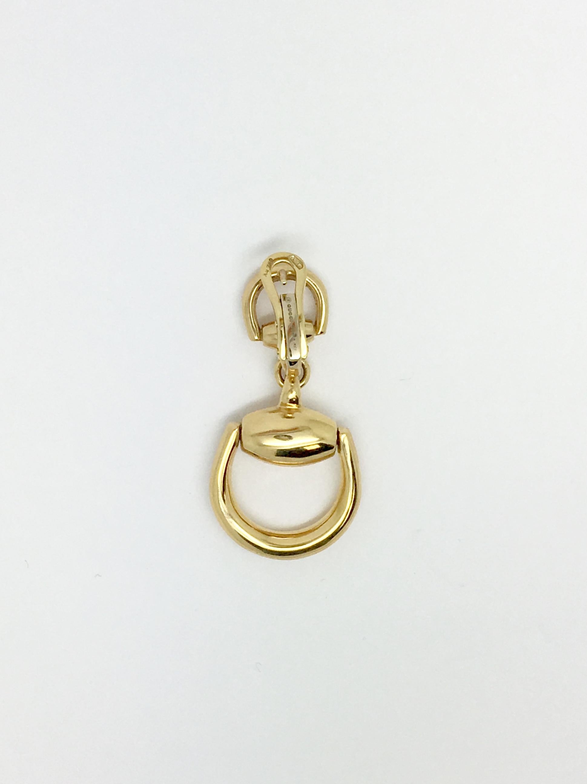 GUCCI horsebit 18 karat yellow gold drop dangle earrings. These earrings are for pierced ears and have an omega style backing that is very comfortable and secure to wear.