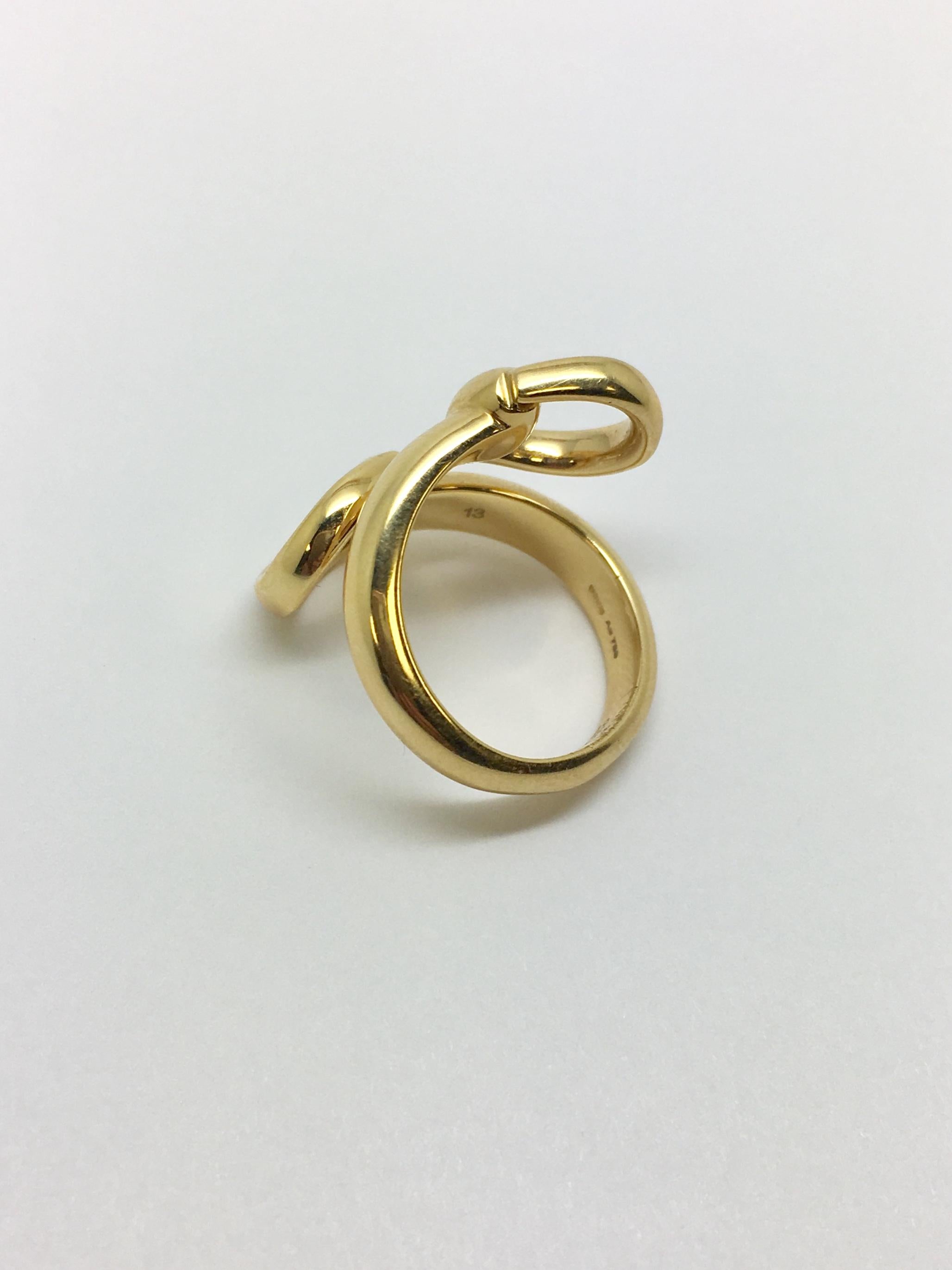 Gucci horsebit gold wrap around ring in 18kt yellow gold. Finger size is approximately 6 1/2