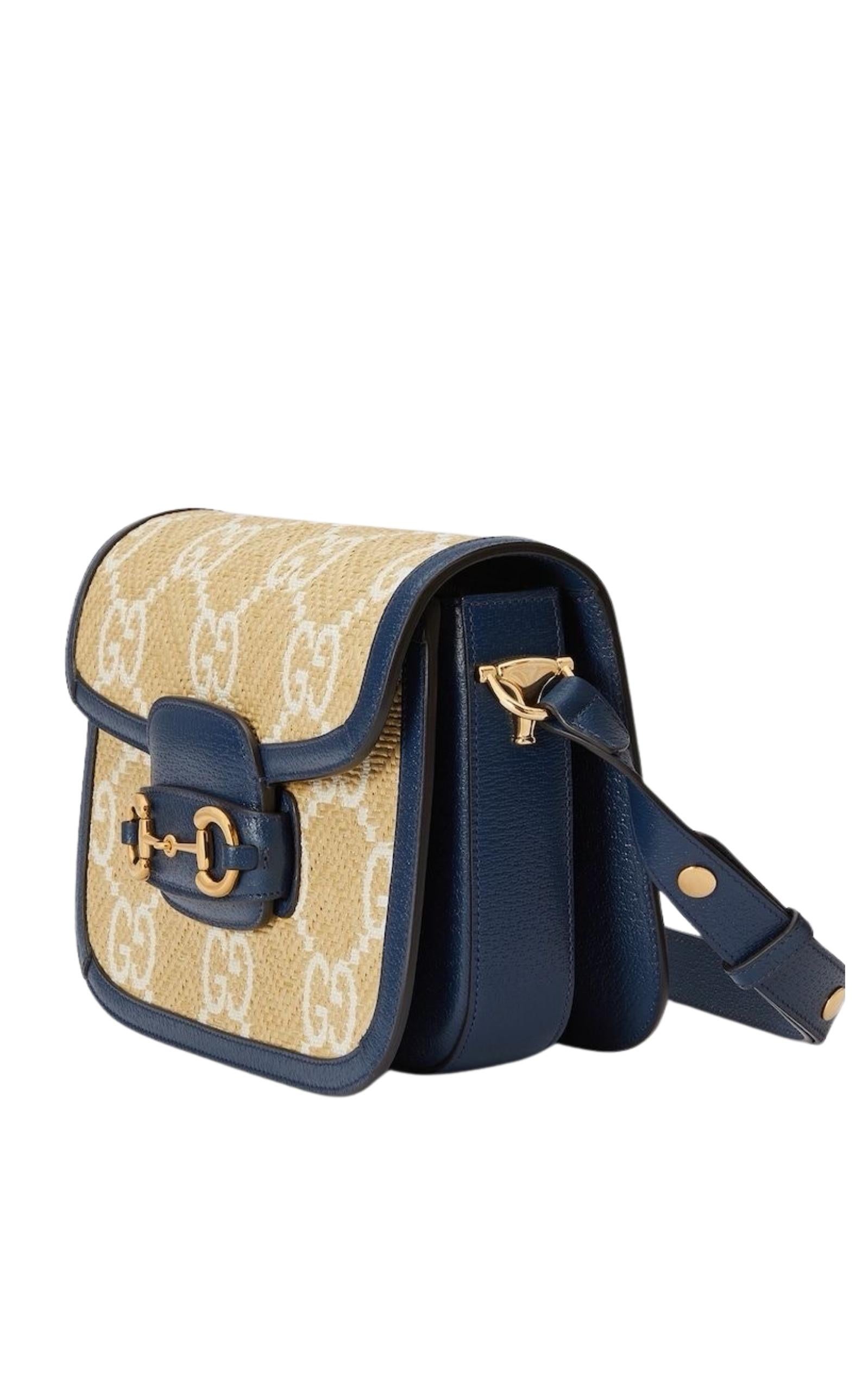 Horsebit Blue Raffia Shoulder Bag features beige, navy blue, raffia, leather trim, Jacquard G monogram motif
Gold-toned hardware
Microfiber lining with a suede-like finish
Horsebit detail at the front
Foldover top
Main compartment
Slip pocket to the