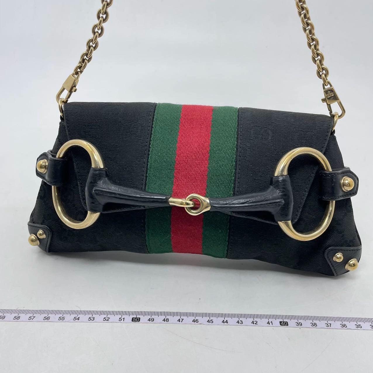 Gucci Horsebit 1955 Chain Cloth Black Gucci Monogram with Iconic Gucci Strip
 These are professional photos of the actual bag offered by Luxbags.
 Make a statement with this small iconic Tom Ford era design Gucci Horsebit 1955 Chain shoulderbag.