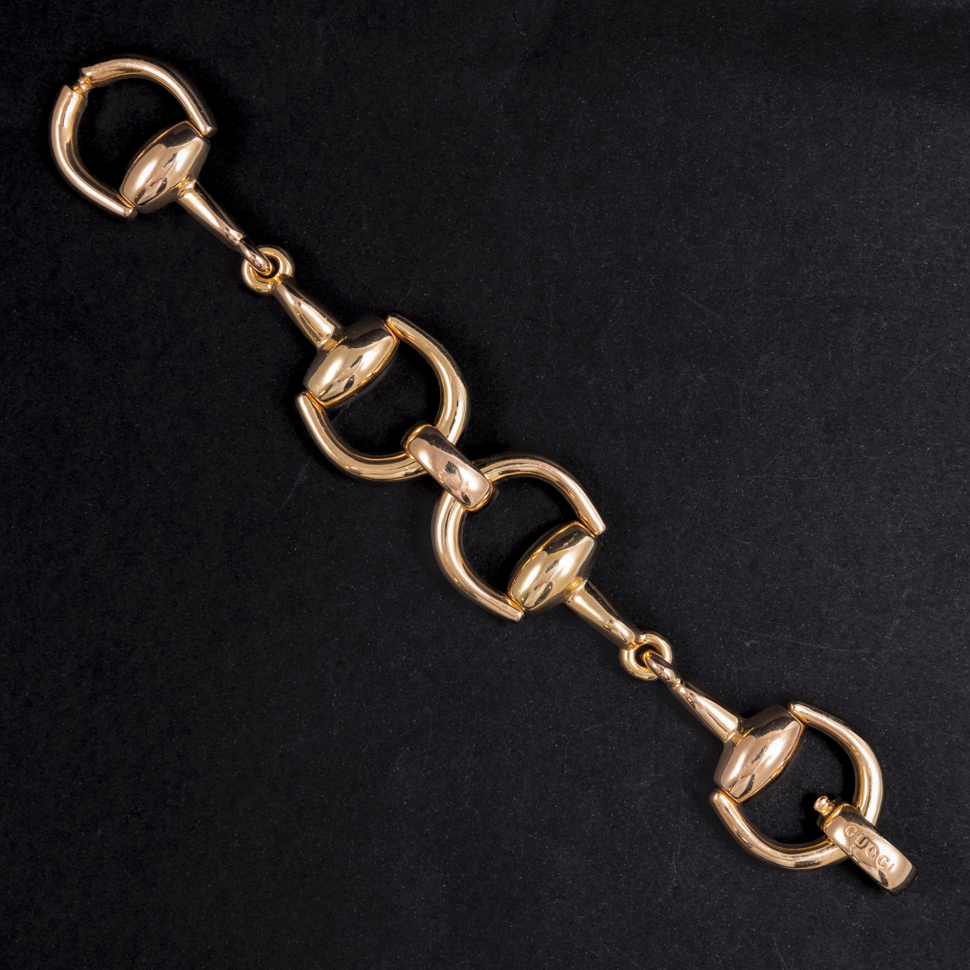 Gucci Horsebit Big Bracelet, Italy, 21st Century. A striking 18k yellow gold Gucci Horsebit bracelet, featuring the iconic equestrian-inspired motif. The design is composed of interlocking horsebit links, polished to a mirror finish, demonstrating