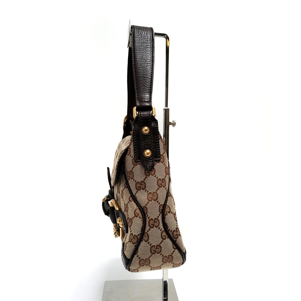 Brand - Gucci
Collection - Horsebit Chain
Estimated Retail - $760.00
Style - Shoulder Bag
Material - Canvas
Color - Brown
Pattern - GG Canvas
Closure - Flap
Hardware Material - Goldtone
Comes With - Dustbag
Size - Medium
Feature - Inner