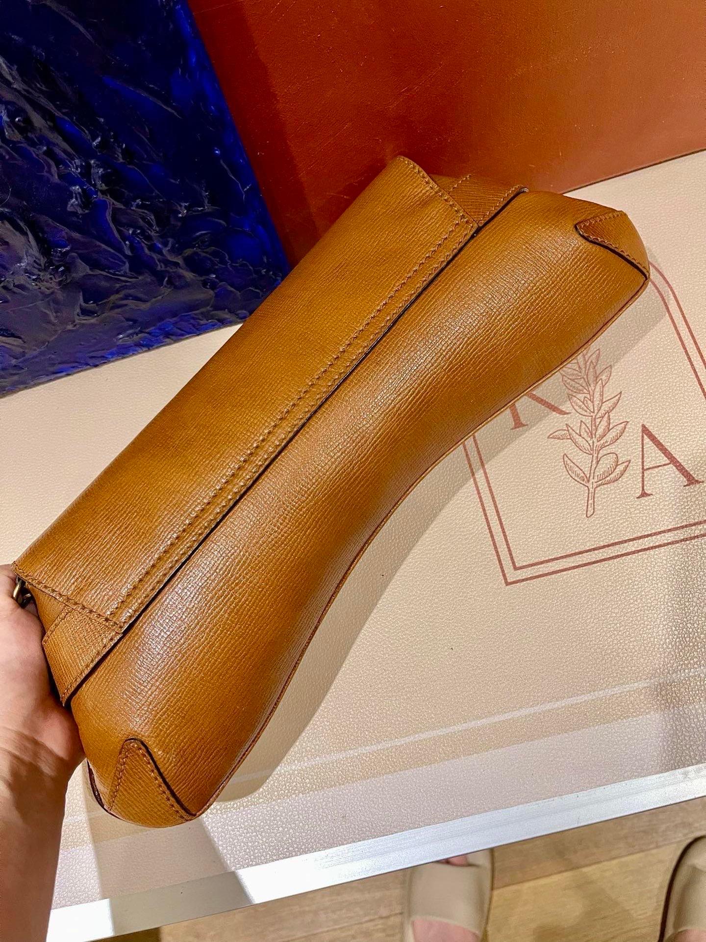 Make a statement with this large Gucci shoulderbag. Crafted from iconic Gucci monogram in beige cloth, with brown leather and gold tone hardware. This cool classic will make heads turn!

This model is revived in the Gucci 2023 Fall/Winter
