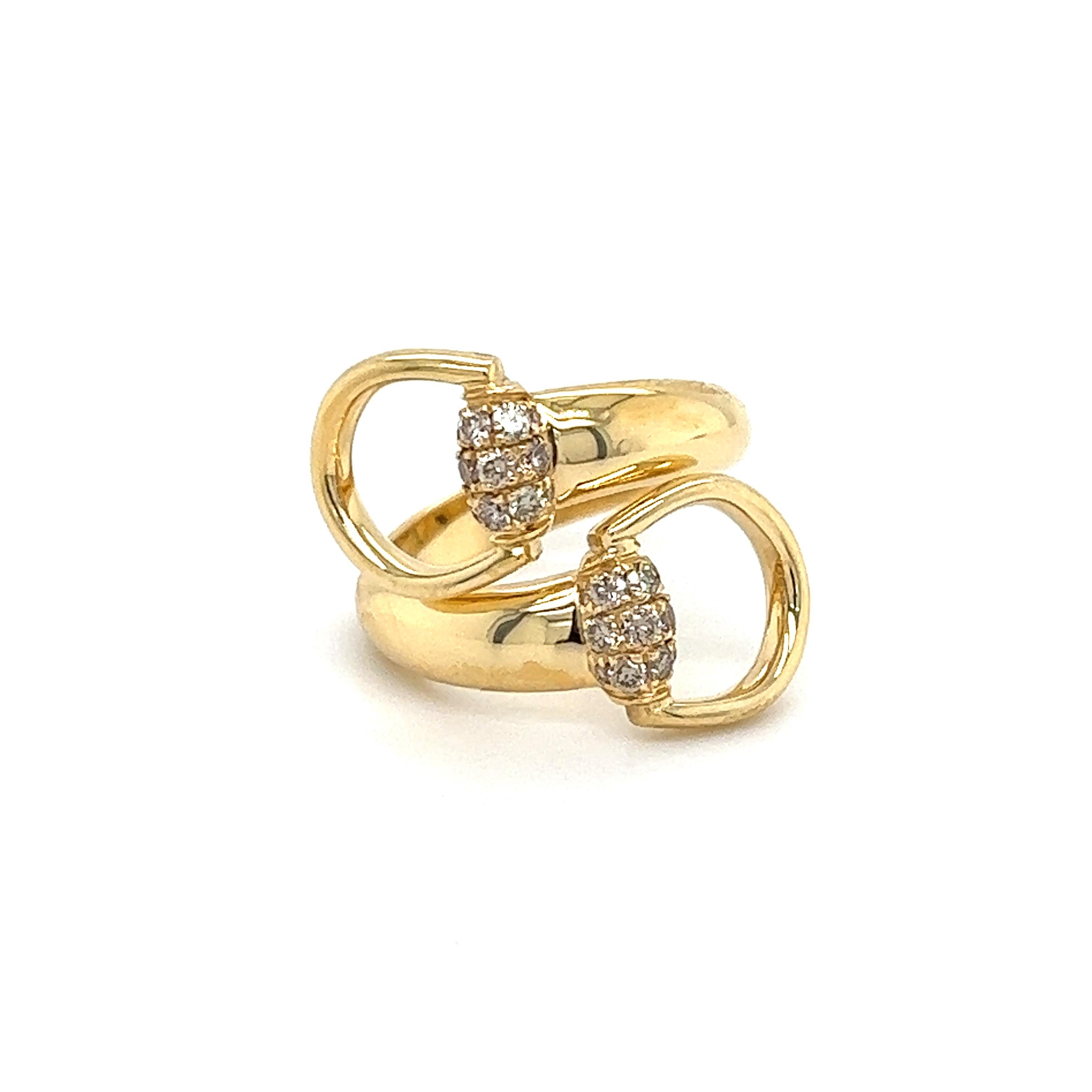 Beautiful ring by famed designer Gucci. Crafted in 18k Gold, this stunning ring features 24 round brilliant cut champagne colored diamonds weighing approximately 0.45 carat. Gucci's iconic Horsebit design highlights the ring as two crossover and lay