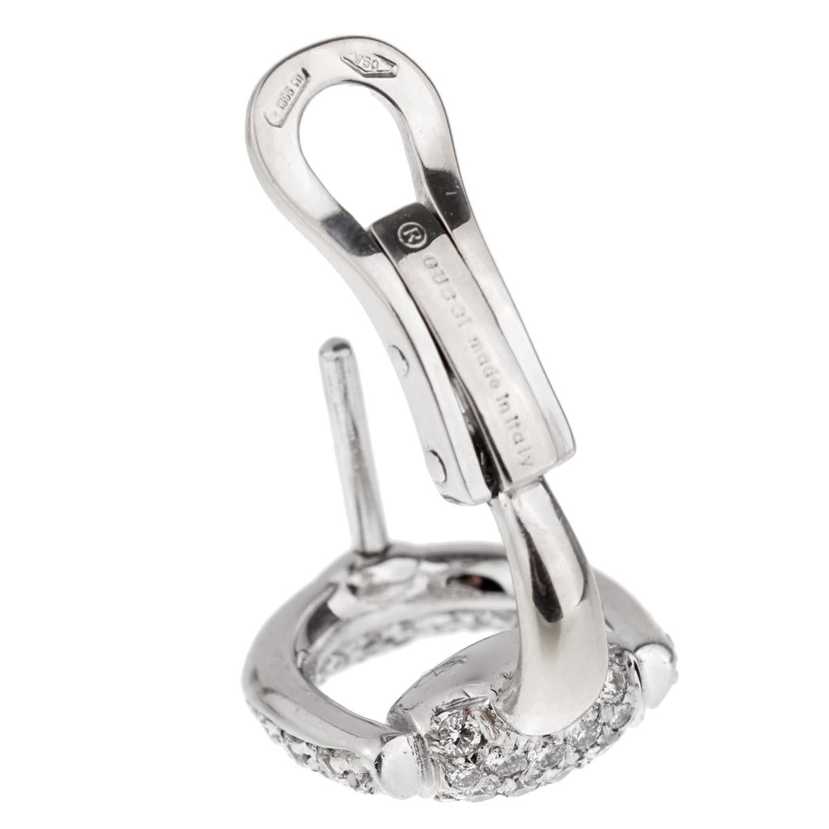 A sensational pair of authentic Gucci earrings featuring the iconic Horsebit design draped with round brilliant cut diamonds in shimmering in 18k white gold. The earrings measures 1/2