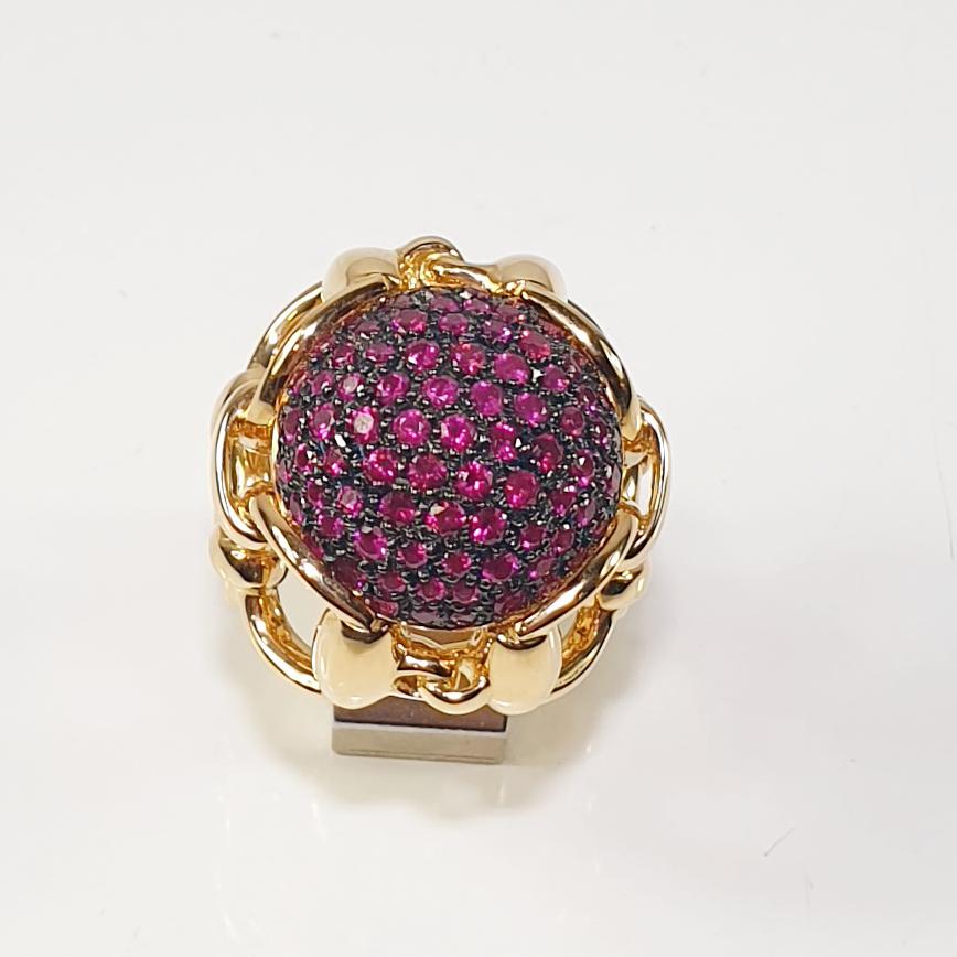 Beautiful and unique very limited edition of  Gucci Horsebit equestrian 18k 18k gold cocktail ring with pink sapphires.   Has a matching pair of earrings and a gold necklace pendant. 
In love with Gucci chunky gold jewels with a high civilized