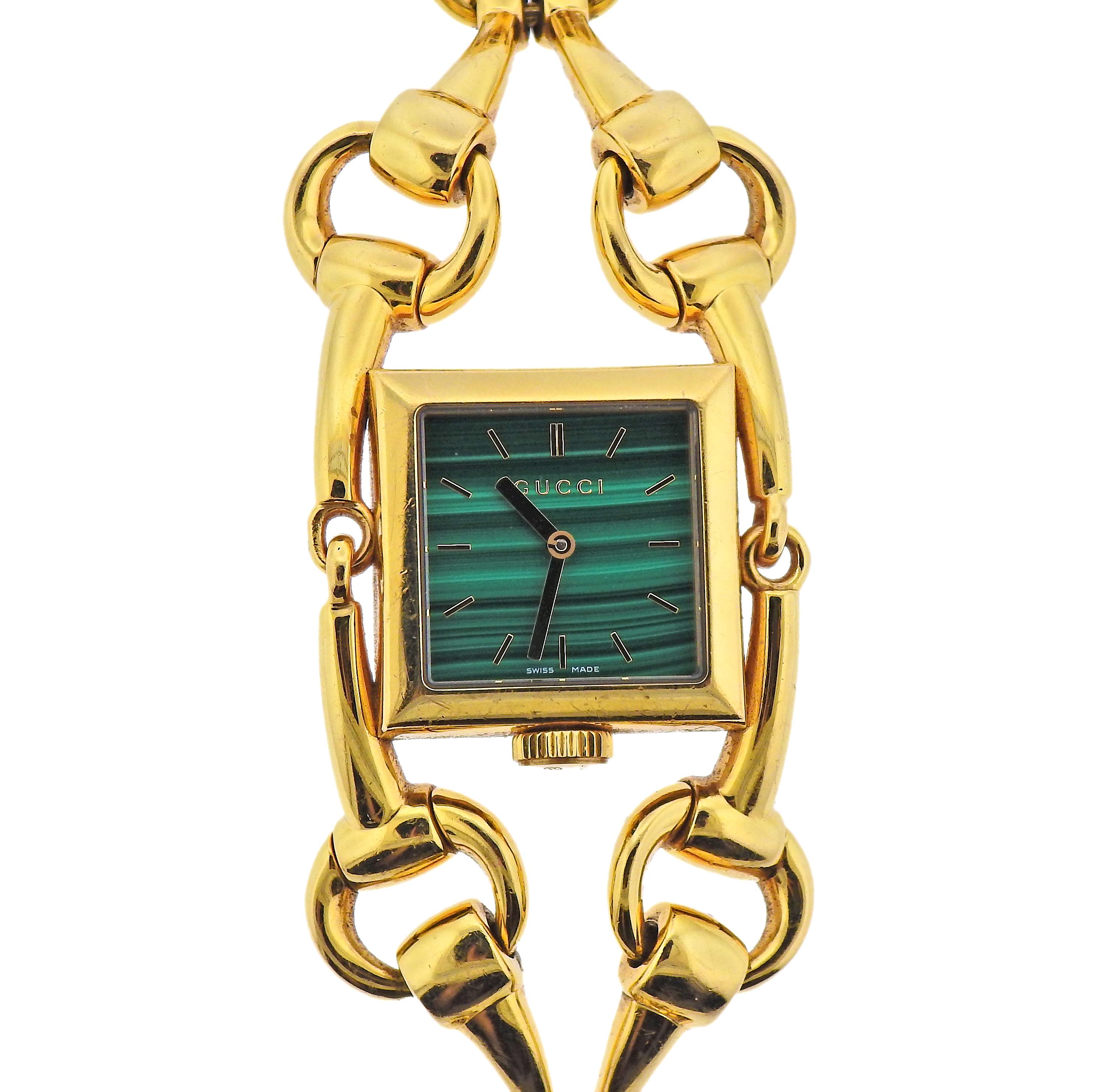 18k yellow gold Gucci Horsebit watch bracelet with malachite dial. Watch with quartz movement. Bracelet is 6