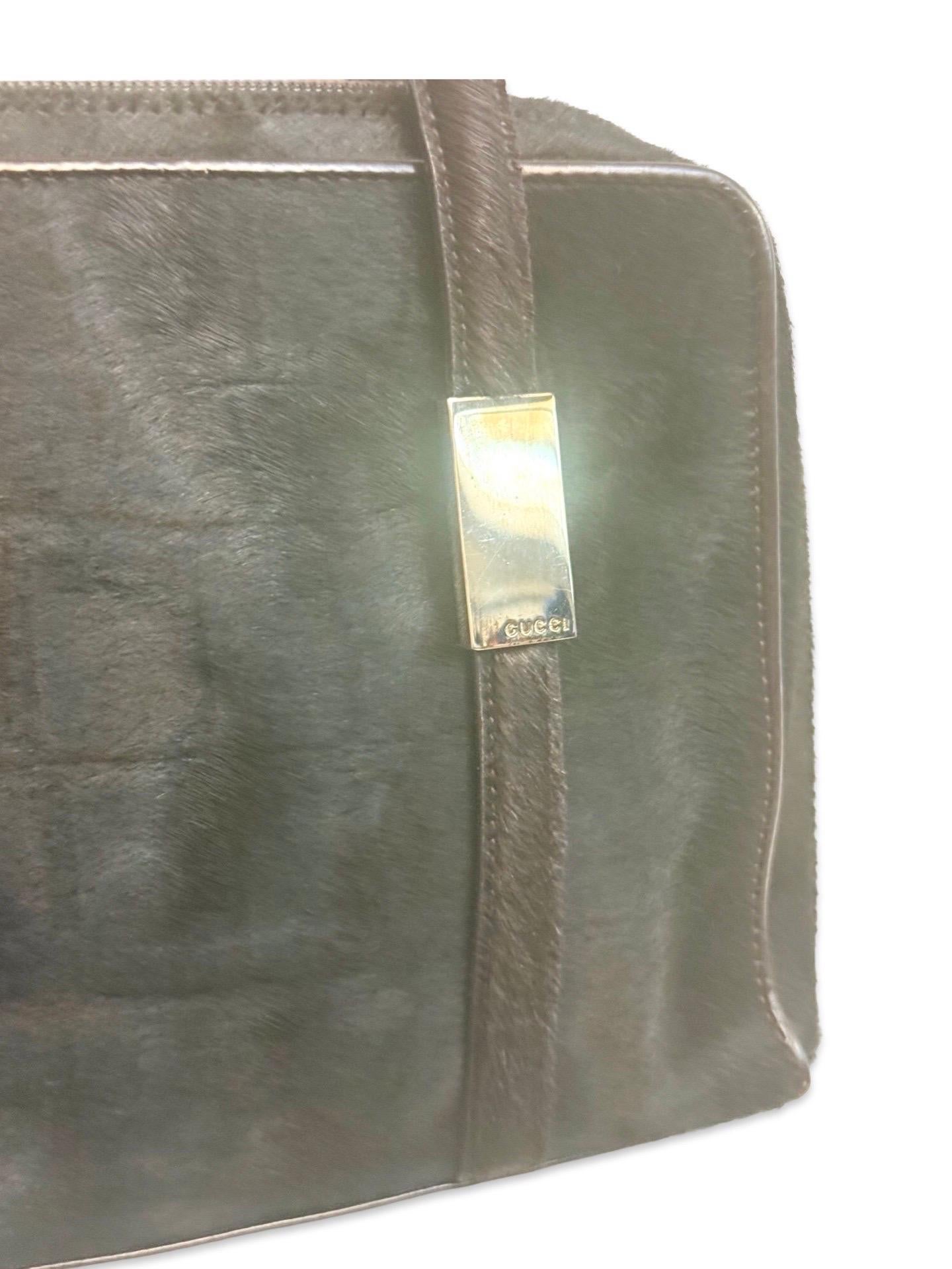 - Iconic vintage Gucci by Tom Ford horsehair and leather shoulder bag from Fall 1996 collection. 

- Silver hardware Gucci on two straps 

- Two zippers fastening. 

- One interior zip pocket closure. 

-Length: 30cm. Full Height: 18cm. Drop Handle:
