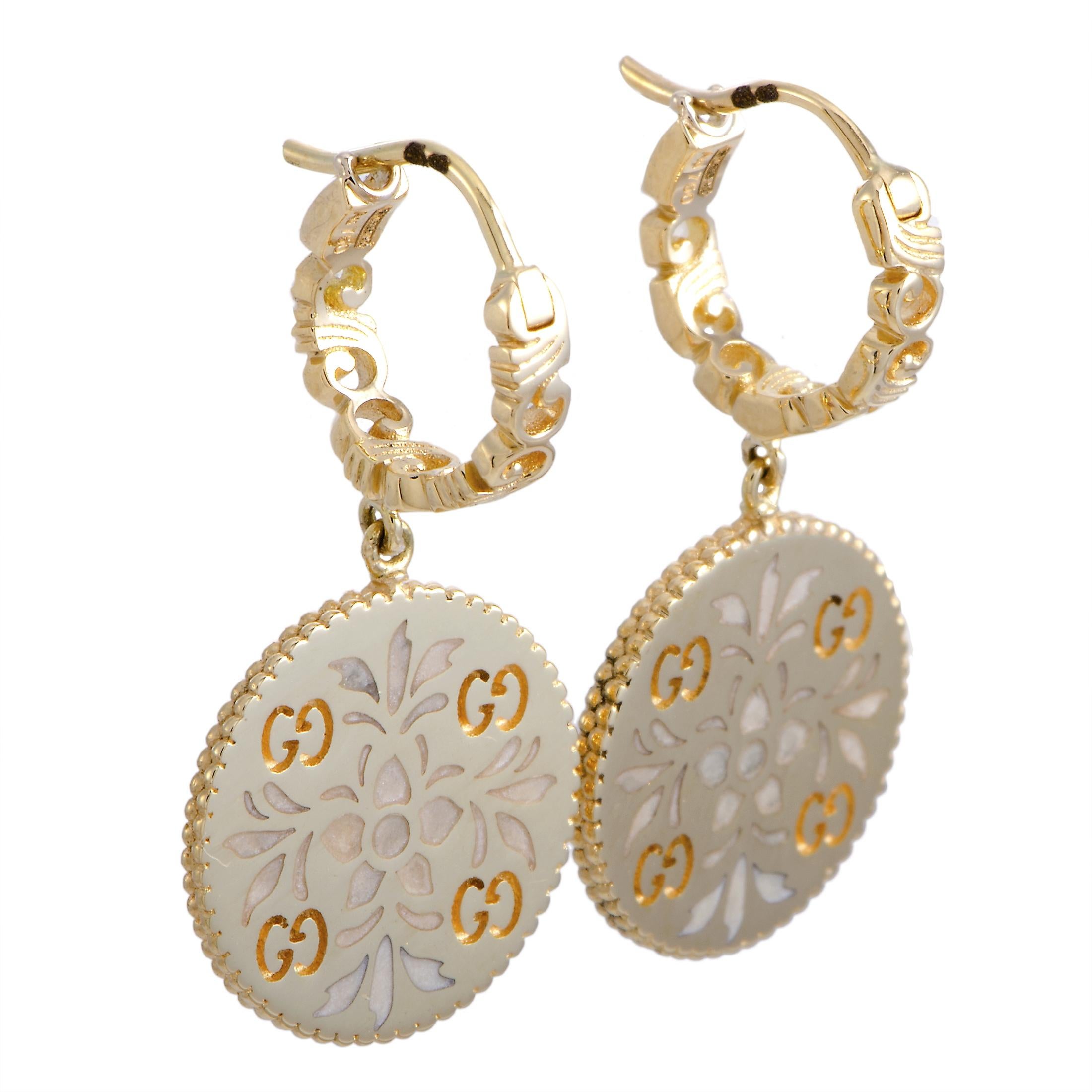 The Gucci “Icon Blooms” earrings are made out of 18K yellow gold and enamel and each of the two weighs 4 grams. The earrings measure 1” in length and 0.50” in width.
 
 Offered in brand new condition, this pair of earrings includes the