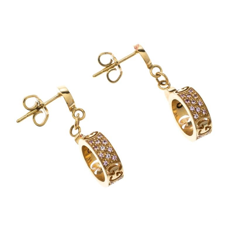 The Gucci Icon Stardust earrings feature 66 pave set pink sapphires and openwork interlocking G embellishments. Crafted out of 18 K gold, these earrings flaunt sophistication and style alongside your love for the brand. These dangling earrings are