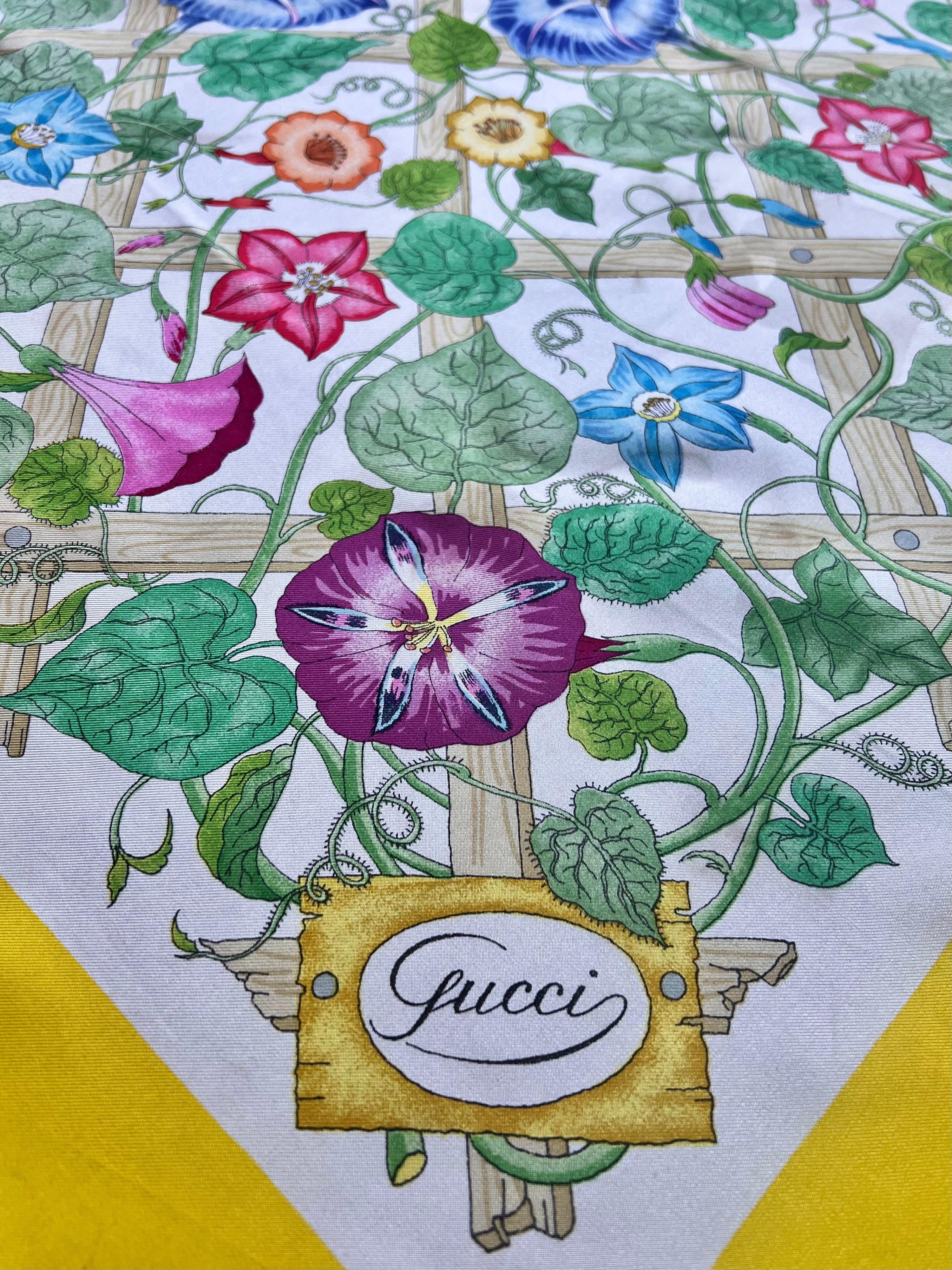 Classic Gucci lattice floral silk scarf with golden yellow border.  Vibrant blue, purple, pink, and green floral motif. Hand-rolled edges. 100% silk. Excellent condition.

Additional information:
Dimensions:
Length: 34