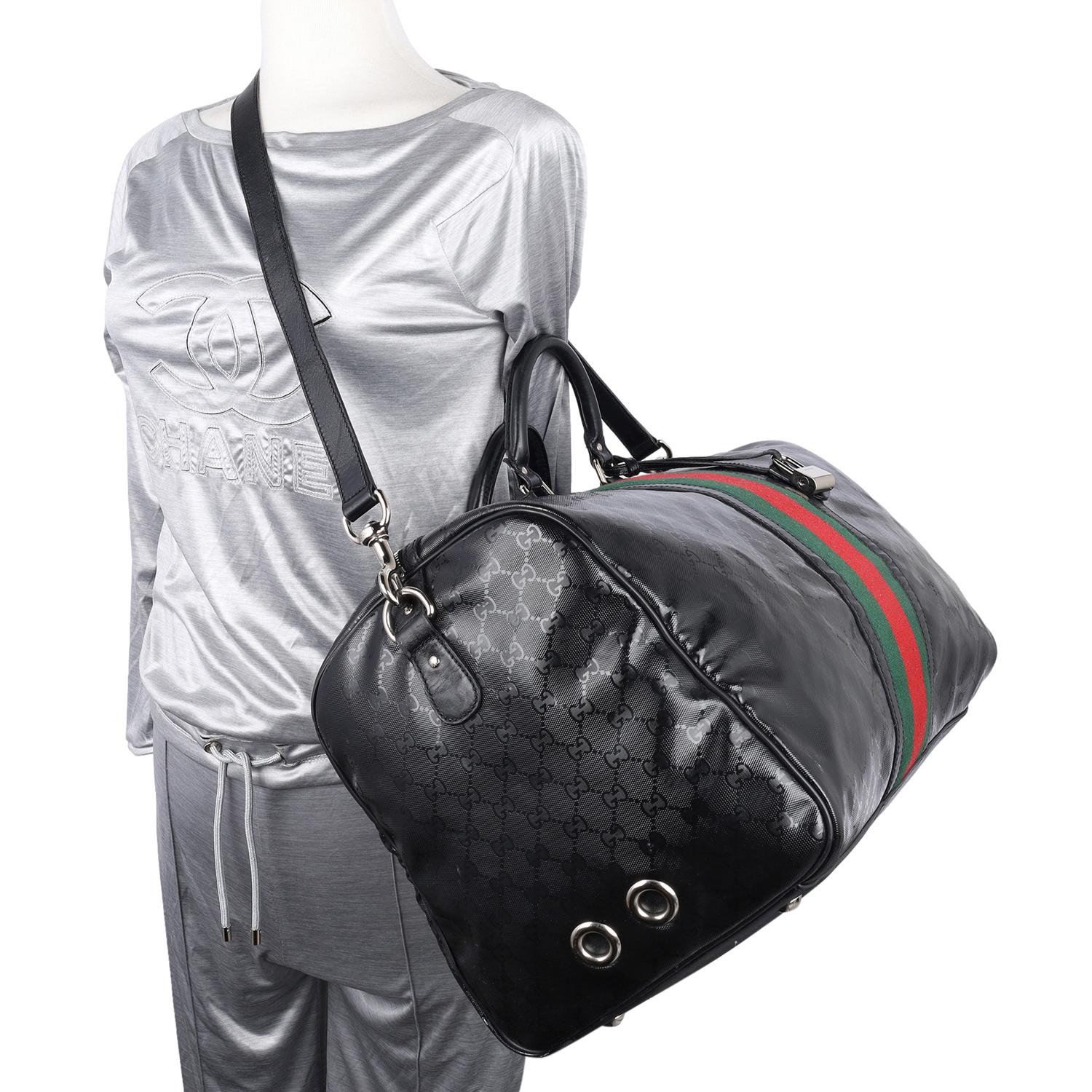Authentic, pre-loved Gucci Imprime Monogram Web Carry On Duffel Bag in Black. This great duffle bag features GG imprimé monogram with black leather trim, silver ruthenium hardware and double handles on top. It comes with an adjustable and detachable