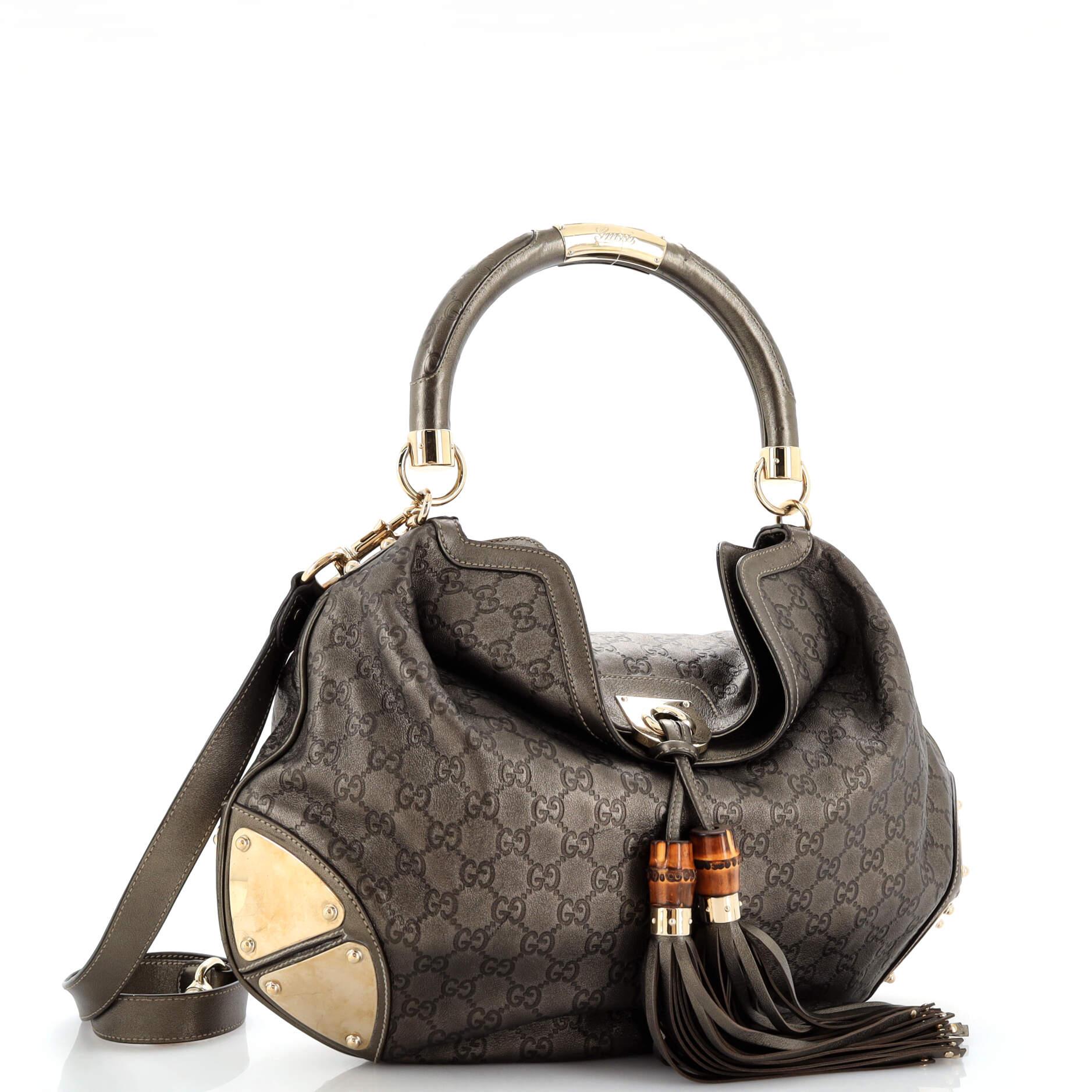 Condition: Very good. Odor in interior. Creasing on exterior and strap, moderate wear and scuffs on exterior, strap, handle and in interior. Cracking on side opening wax edges, scratches, tarnish and discoloration on hardware.
Accessories: With