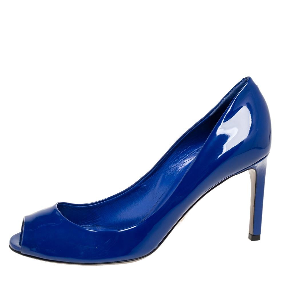 Made from high-end patent leather, these stunning ink blue pumps from Gucci are a splendid example of luxury and style. They feature peep-toes and 8 cm heels for a comfy fit. A pair of gorgeous pumps like this one is a closet must-have!

Includes:
