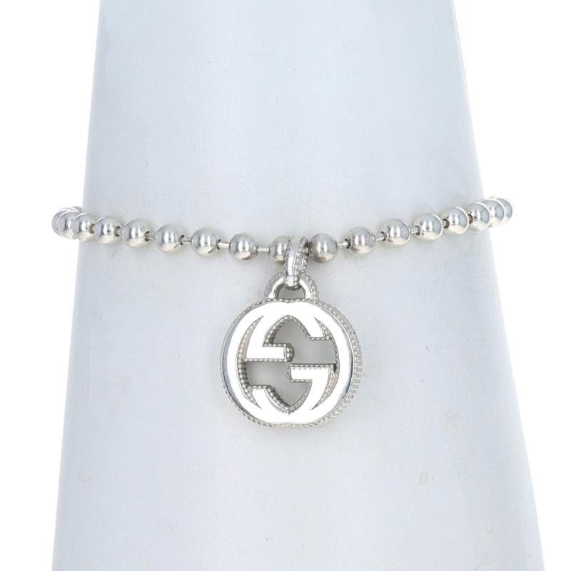 Retail Price: $380

Brand: Gucci
Design: Interlocking G Logo

Metal Content: Sterling Silver

Style: Charm
Chain Style: Ball
Bracelet Style: Chain
Fastening Type: Lobster Claw Clasp

Measurements

Item 1: Bracelet
Length: 7