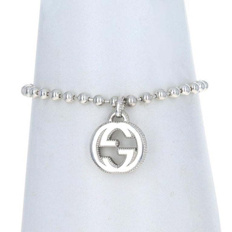 Interlocking g charm in silver sale
