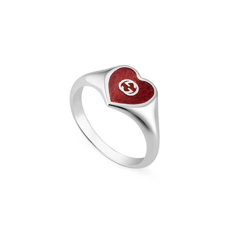 Gucci Ladies Interlocking G Red Enamel Heart Ring. 

This silver-tone/ red sterling silver Interlocking G heart ring from Gucci. Featuring a red enamel with silver Interlocking G stencil and engraved details at base of the heart. Made in Italy.