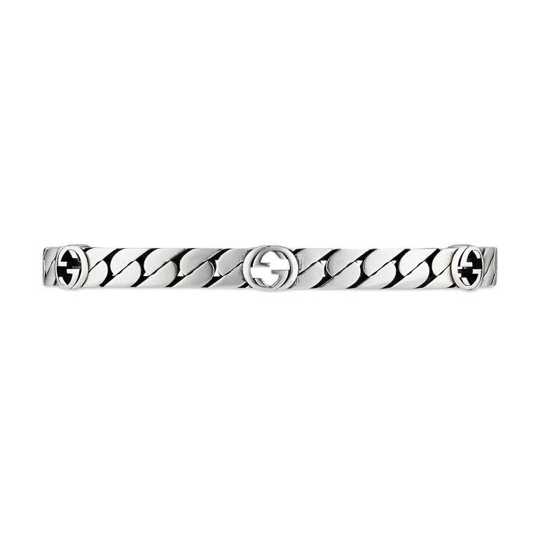 Fall in love with the chic simplicity of this stunning GUCCI Interlocking G Cuff. The interlocking G design was originally championed by GUCCI in the 70's, and is now one of the fashion houses key motif's. Showcase this unisex design or create the