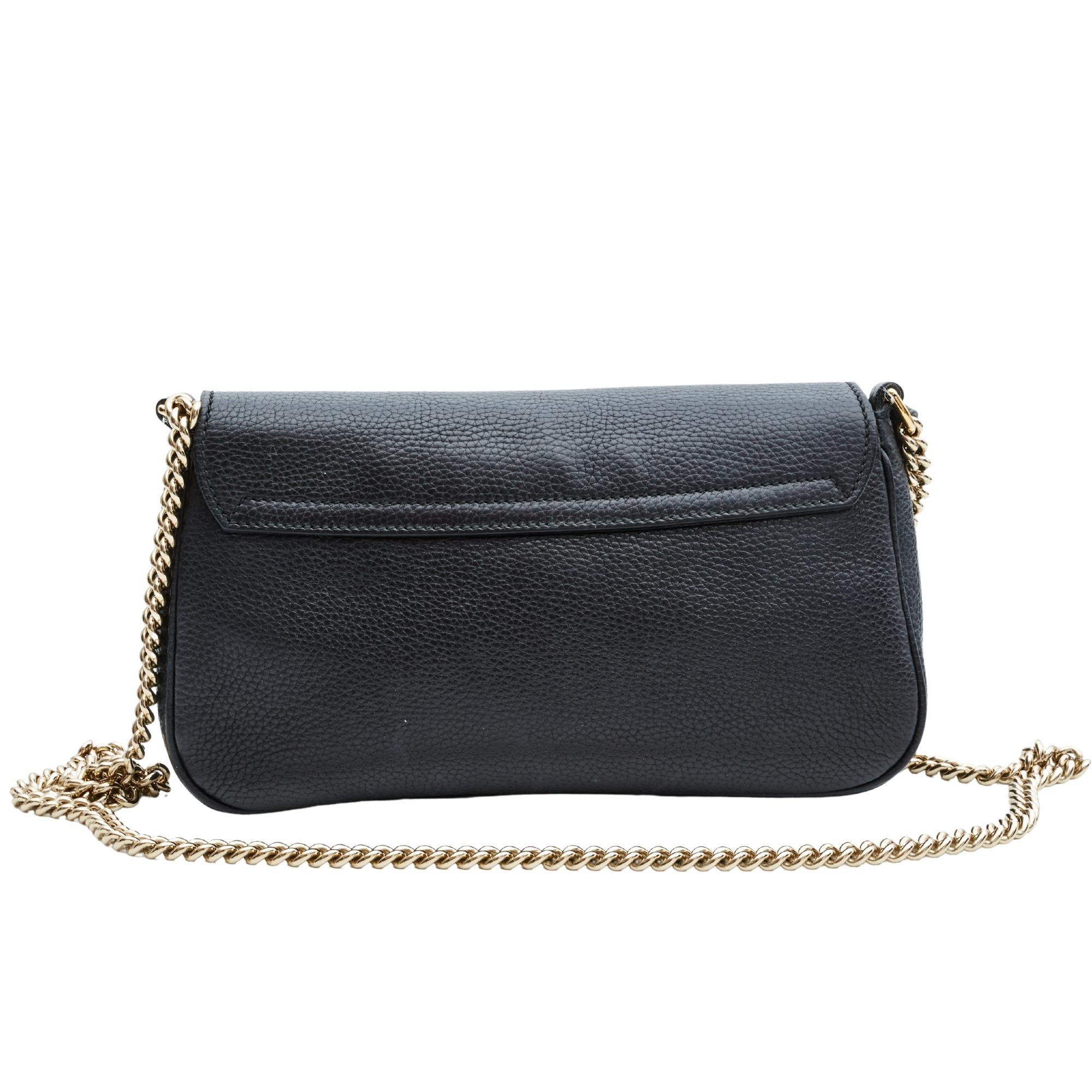 This bag is made of textured pebbled leather in black and features flap closure, light gold hardware, a black leather tassel, embossed interlocking GG on front flap and a slip and zip pocket.

COLOR: Black
MATERIAL: Leather
ITEM CODE: 336752