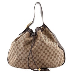 Gucci - Sac Hobo à cordon coulissant imbriqué « Icon » en toile GG - Large