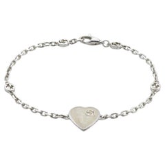 Gucci Pulsera de plata de ley con corazones entrelazados de esmalte blanco YBA645546003