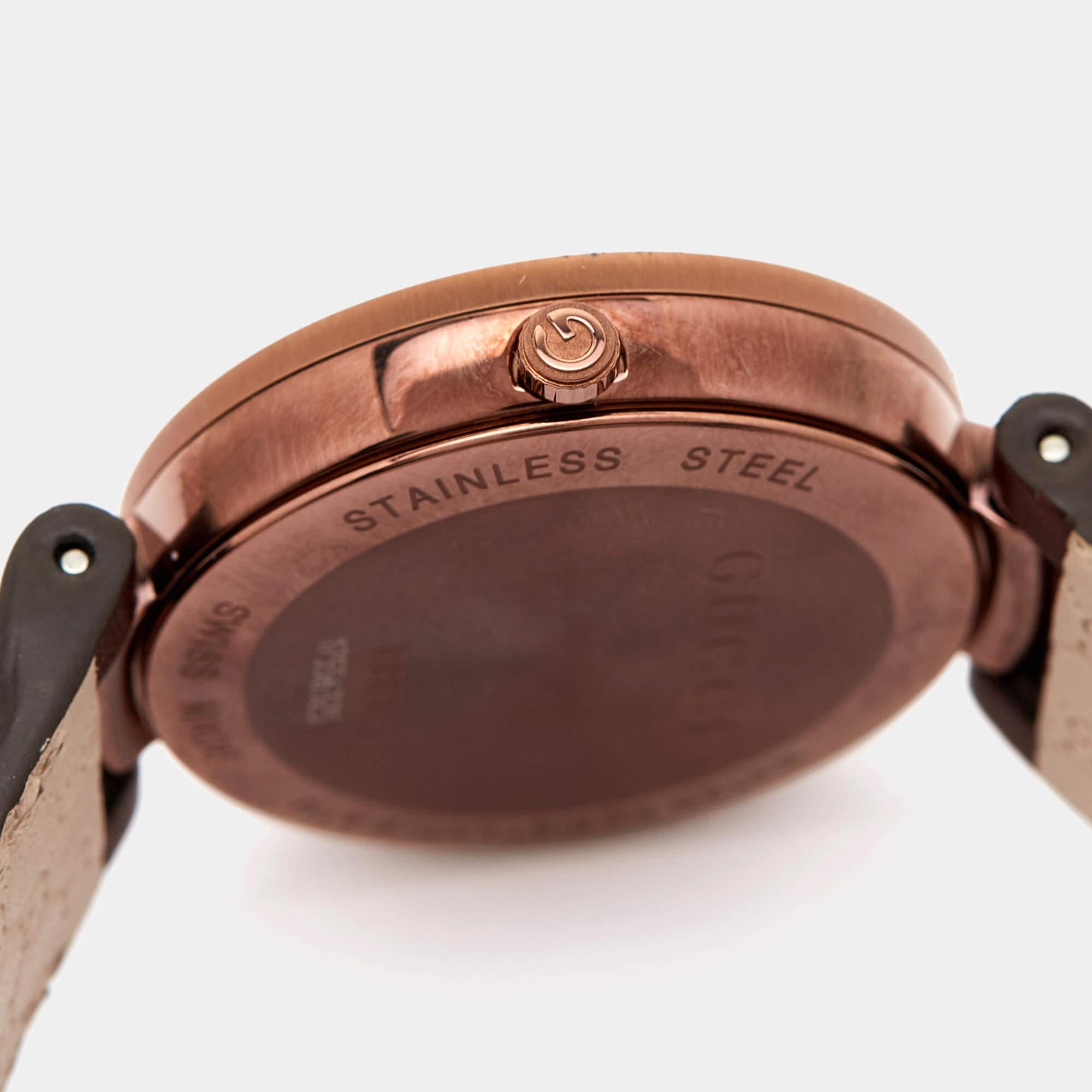 The Gucci 133.3 women's watch is an elegant timepiece that exudes sophistication. Featuring a brown ion-plated stainless steel case and a leather strap, it showcases the iconic interlocking G logo-shaped bezel. This watch effortlessly combines style