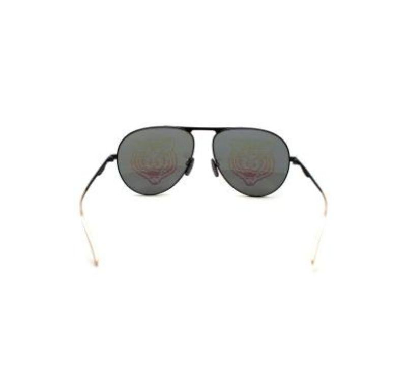 Gucci Iridescent Aviator Sunglasses

- Black and Silver-tone Hardware
- Aviator 
- Multicolor hologram tiger lenses

Material
Acetate and metal

